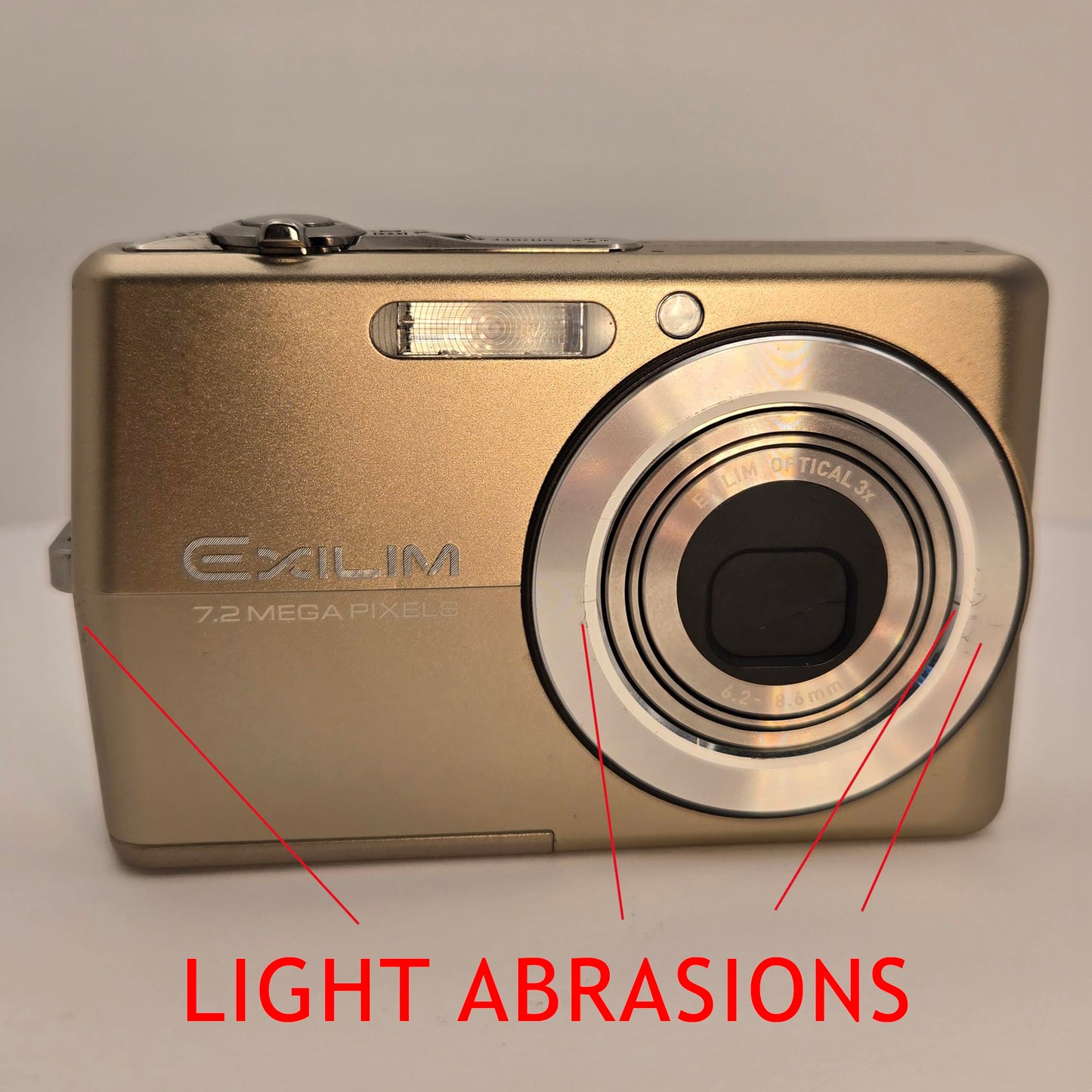 Yahemi Exilim Ex-Z700 7.2 MP Compact Digital Camera Bundle with Carrying case, Tripod, Battery & Charger and a Microfiber Cloth [Gold]