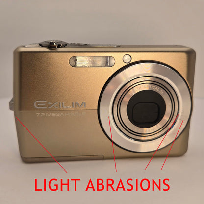 Yahemi Exilim Ex-Z700 7.2 MP Compact Digital Camera Bundle with Carrying case, Tripod, Battery & Charger and a Microfiber Cloth [Gold]